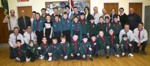1st Ballymacash Explorers, Scouts and Cubs pictured at an ‘Investiture Evening’ in St Mark’s Church, Ballymacash.  Included are St Mark’s rector, the Rev Canon George Irwin - District Chaplain (second from left in back row), Noel Irwin - District Commissioner and Cubs Leader (left at front), Ivor Watson - Scout Leader (right in back row) and Russell McQuillen - Explorers Leader (second from right in back row).